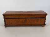 a small wooden box with a drawer on top of it