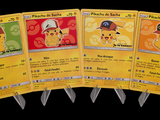 Plusieurs cartes Pokémon sont alignées les unes à côté des autres sur un fond noir.