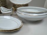 a lot of plates and bowls that are on the table