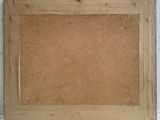 a wooden frame with a cork board attached to it