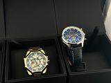 two watches that are in a box on the table