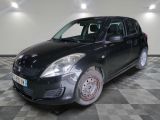a picture of a small black car on a checkered floor