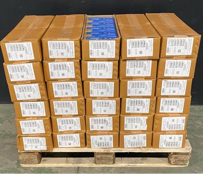 several stacks of cardboard boxes stacked on top of a pallet