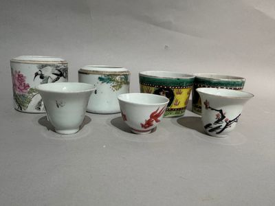 five cups sitting next to each other on a table