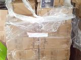 a stack of boxes with a cell phone on top of it