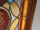 an image of a stained glass window with a horse on it