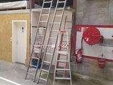 a ladder that is leaning against a wall in a garage