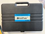 a black briefcase with a name tag on it