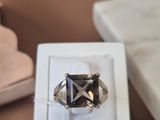 a ring that is sitting in a box on a table