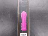 a pink object in the package on a black background