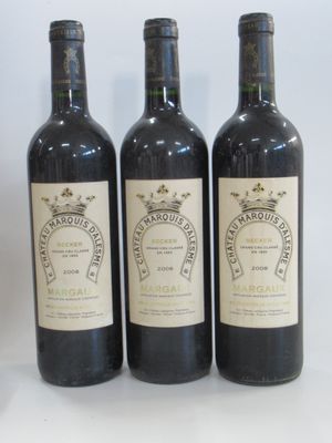three bottles of wine sitting next to each other on a table