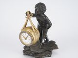 a statue of a boy holding a clock in his hand