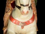 a figurine of an angel riding a horse