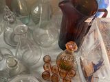 a table with a lot of glass items on it