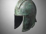 un casque en bronze sur fond gris