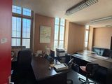 an image of an empty office with a desk and chairs