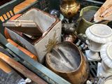 a basket full of dishes and utensils sitting on a table