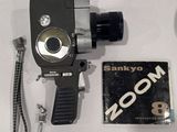 a black camera and a book on a table