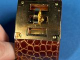 a person holding a small box with a lock on it