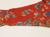 a close up of a red shirt with a pattern on it