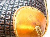 a close up of a purse on a table