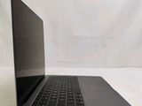 an open laptop computer sitting on top of a white surface
