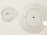two plates on the wall with the same design on them
