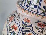 a large vase with a floral design on it