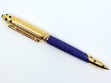a close up of a pen on a white surface with a white background