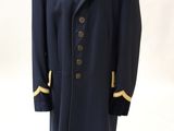 an image of a man ' s coat on a mannequin stand