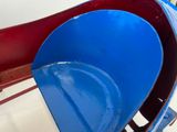 a blue and red water slide in the middle of a room