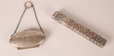 a silver purse and a silver purse hanging on a chain