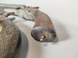 a close up of two old guns on a table
