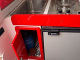 an image of a kitchen with a sink and a refrigerator