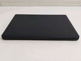 a close up of a laptop computer sitting on a white surface