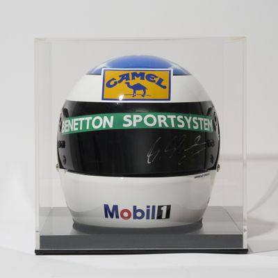 helmet in a clear display case with a logo on it
