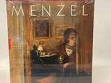 an image of a book with a picture of a man sitting at a table
