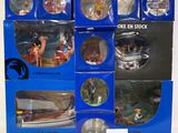 six boxed boxes of action figures of people and animals in blue boxes