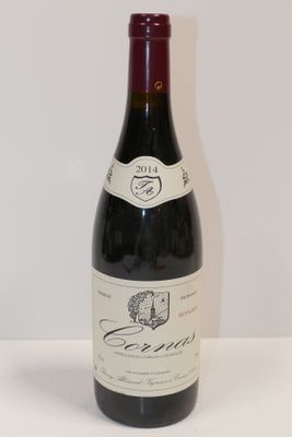 a bottle of wine that is sitting on a table