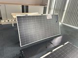 two solar panels sitting on the floor in the room