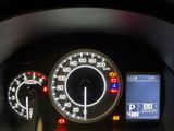 a close up of a car dashboard with a speedometer