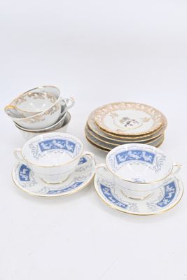 six blue and white china cups and saucers