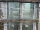 a picture of a pallet of windows in a warehouse