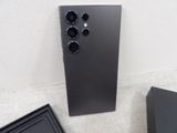 a close up of a black box with three cameras on top of it