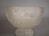 a glass bowl with a design on it on a table