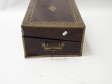 a small wooden box with a lid on a white surface