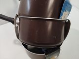 pots and pans stacked on top of each other on a counter
