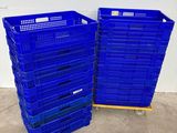 two blue plastic crates stacked on top of each other