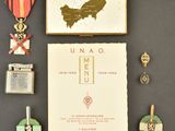 an image of a collection of medals and a book on a table
