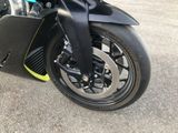 a close up of a motorcycle parked in a parking lot